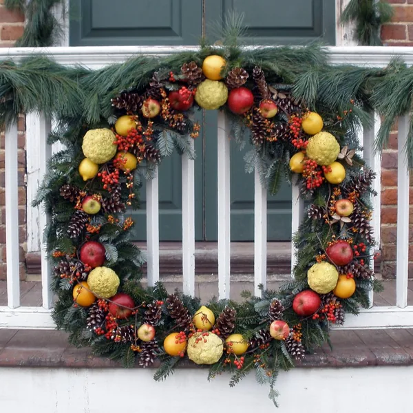 Holly wreath with a red ribbon