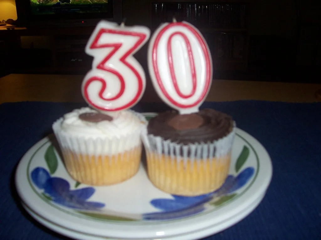 Birthday cake topped with lit candles